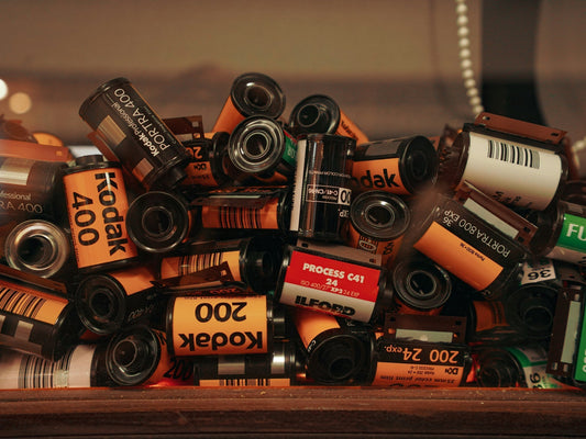 Image showcasing the resurgence of film photography, highlighting the growing demand for film rolls, increased production by major brands like Kodak and Fujifilm, and the revival of vintage cameras and analog creativity.